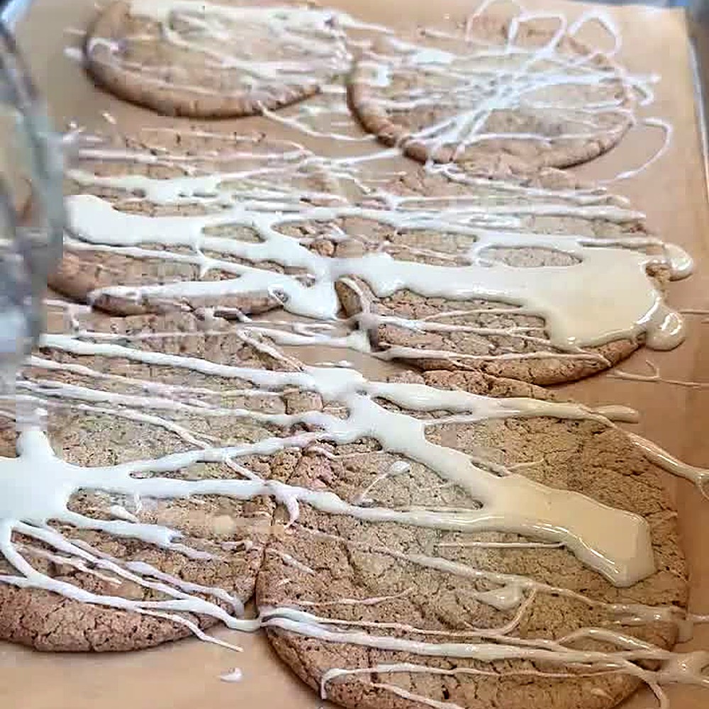 Maple glaze drizzled over gluten-free brown sugar cookies